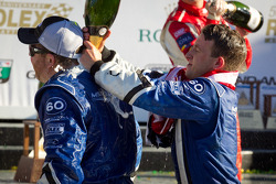 DP podium: A.J. Allmendinger celebrates with Michael Shank