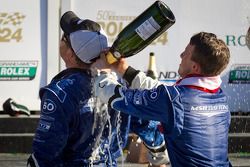 DP podium: A.J. Allmendinger celebrates with Michael Shank