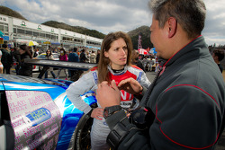 Cyndie Allemann talks with her engineer moments before the start