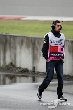 Sebastien Buemi, Red Bull Racing and Scuderia Toro Rosso Reserve Driver watches practice trackside