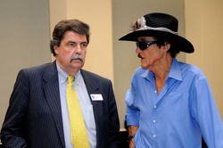 Mike Helton, President of NASCAR, speaks with Hall of Famer Richard Petty