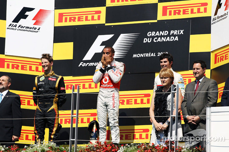 The podium, Romain Grosjean, Lotus F1 Team, second; Lewis Hamilton, McLaren Mercedes, race winner; Sergio Perez, Sauber, third