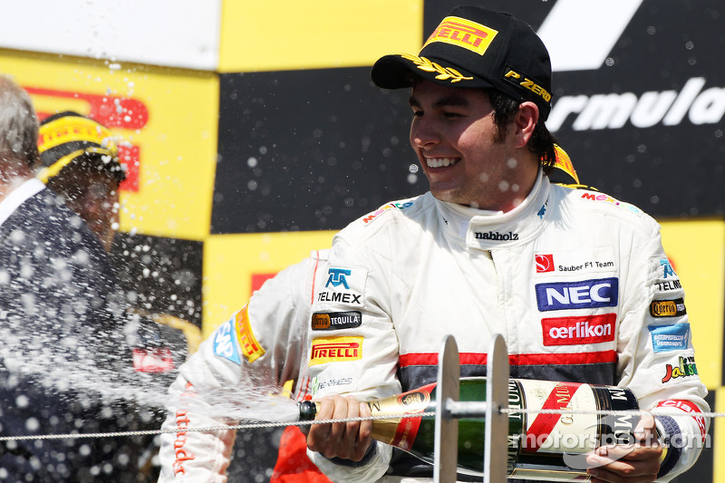 Sergio Perez, Sauber celebrates his third position on the podium