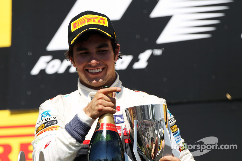 Sergio Perez, Sauber celebrates his third position on the podium