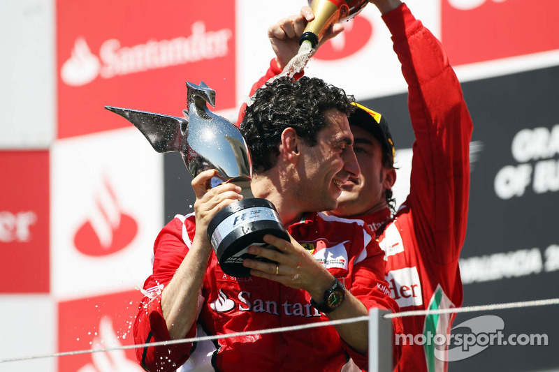 Race winner Fernando Alonso, Ferrari celebrates on the podium with Andrea Stella, Ferrari Race Engineer