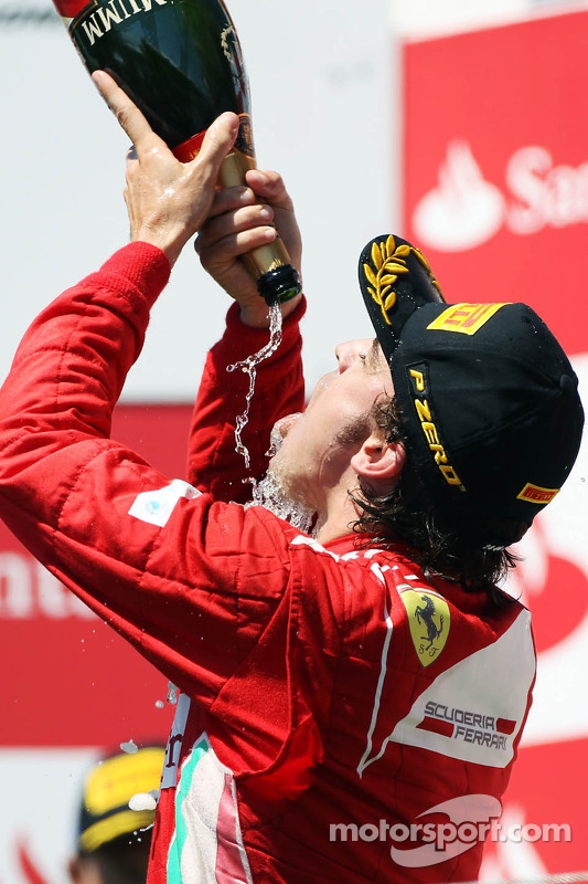 Race winner Fernando Alonso, Ferrari celebrates on the podium