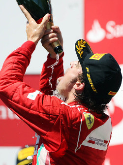 Race winner Fernando Alonso, Ferrari celebrates on the podium