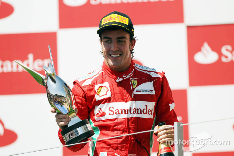 Race winner Fernando Alonso, Ferrari celebrates on the podium