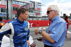 Bernd Maylander, FIA Safety Car Driver with Charlie Whiting, FIA Delegate on the grid