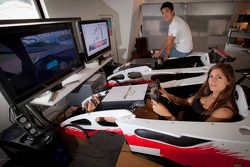 Cyndie Allemann and Hideto Yasuoka in a racing simulator