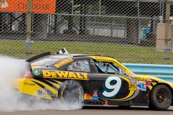 Winner Marcos Ambrose celebrates