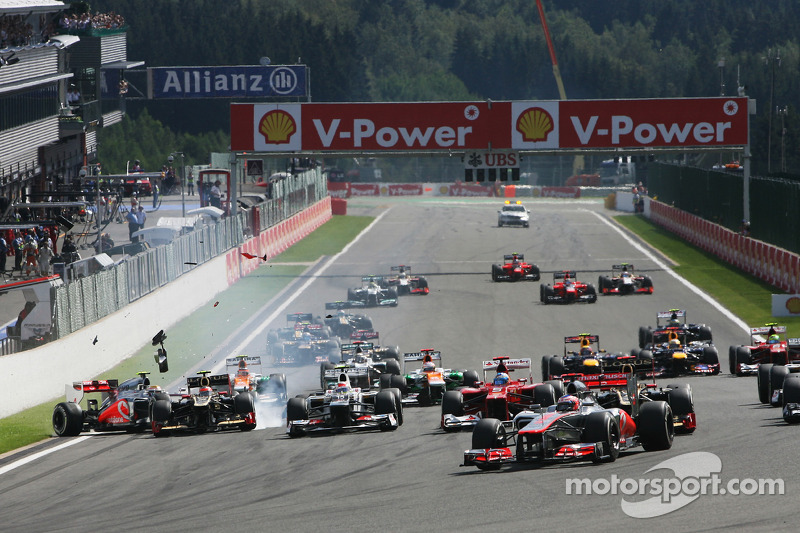 Jenson Button, McLaren leads at the start as a crash ensues involving Lewis Hamilton, McLaren and Ro