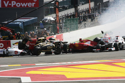 A crash at the start involving Lewis Hamilton, McLaren, Romain Grosjean, Lotus F1, Fernando Alonso,