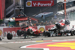A crash at the start involving Lewis Hamilton, McLaren, Romain Grosjean, Lotus F1, Fernando Alonso, Ferrari, Kamui Kobayashi, Sauber