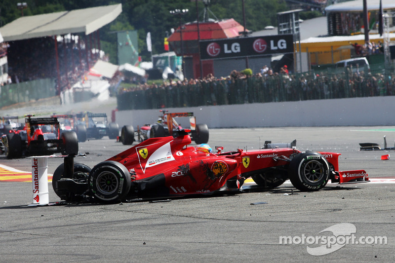 A crash at the start involving Fernando Alonso, Ferrari