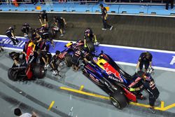 Sebastian Vettel, Red Bull Racing and Mark Webber, Red Bull Racing pushed back in the pits