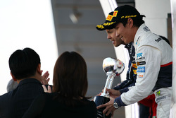 Kamui Kobayashi, Sauber celebrates his third position on the podium