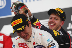 Kamui Kobayashi, Sauber celebrates his third position on the podium with race winner Sebastian Vettel, Red Bull Racing