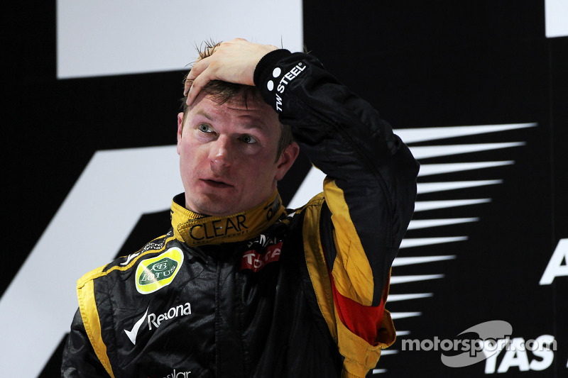 Race winner Kimi Raikkonen, Lotus F1 Team celebrates on the podium