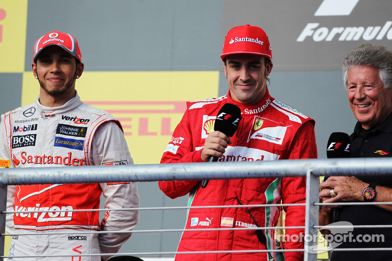 race winner Lewis Hamilton, McLaren with Fernando Alonso, Ferrari and Mario Andretti, on the podium