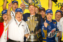 Championship victory lane: 2012 NASCAR Sprint Cup Series champion Brad Keselowski, Penske Racing Dodge celebrates with Roger Penske and his team