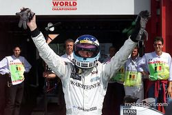 Mika Hakkinen celebrates pole position