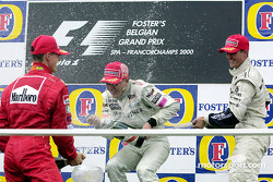 Podium: race winner Mika Hakkinen, second place Michael Schumacher, third place Ralf Schumacher