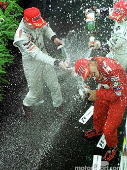 Podium: race winner Mika Hakkinen, second place Michael Schumacher, third place Ralf Schumacher