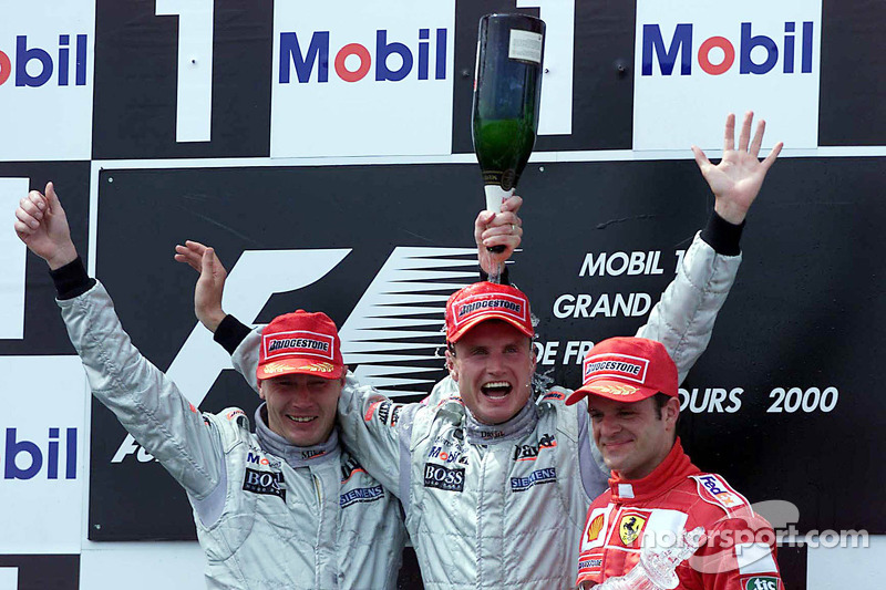 Podium: race winner David Coulthard, second place Mika Hakkinen, third place Rubens Barrichello