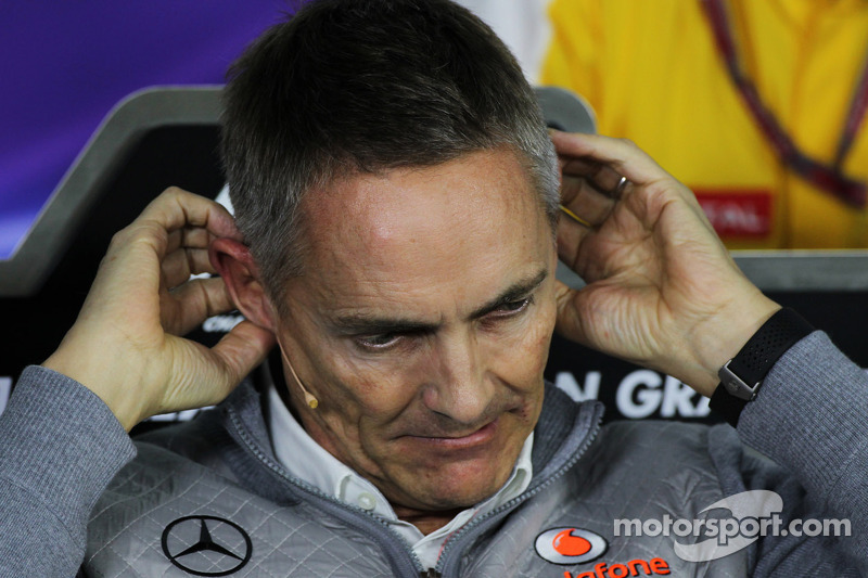 Martin Whitmarsh, McLaren Chief Executive Officer gets to grips with his microphone in the FIA Press