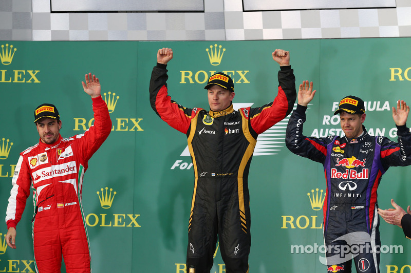 The podium, Ferrari, second; Kimi Raikkonen, Lotus F1 Team, race winner; Sebastian Vettel, Red Bull Racing, third