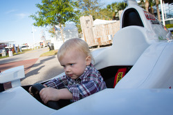 Dan Wheldon Memorial and Victory Circle unveiling ceremony: Oliver Wheldon has fun in an IndyCar