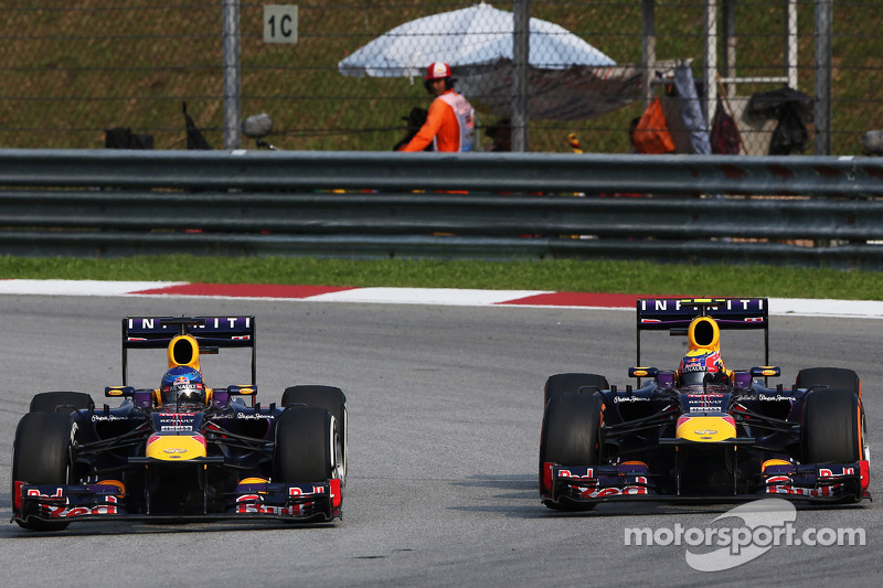 Sebastian Vettel, Red Bull Racing RB9 and team mate Mark Webber, Red Bull Racing RB9 battle for the lead of the race