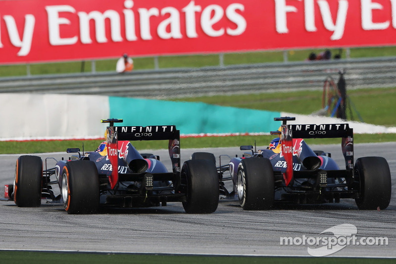 Sebastian Vettel, Red Bull Racing RB9 and team mate Mark Webber, Red Bull Racing RB9 battle for the 