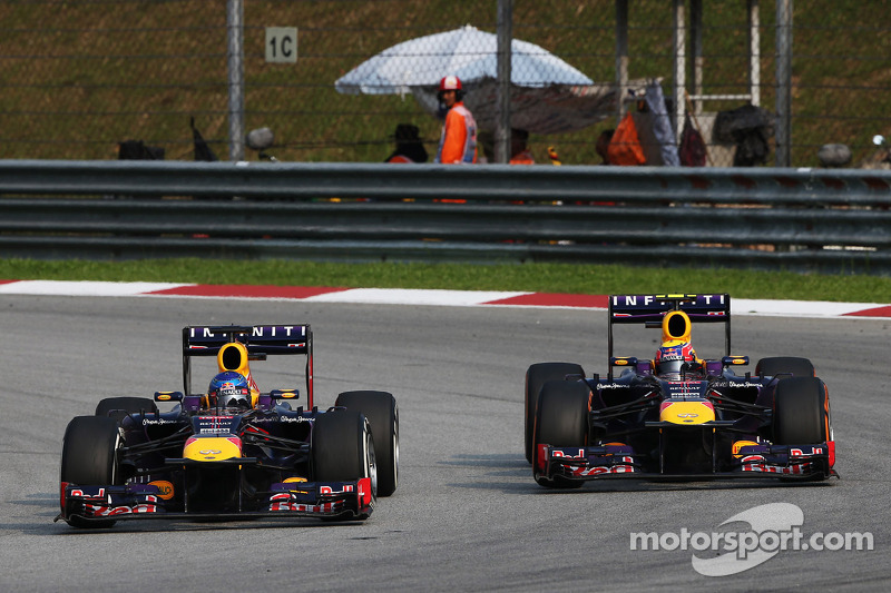 Sebastian Vettel, Red Bull Racing RB9 and team mate Mark Webber, Red Bull Racing RB9 battle for the 