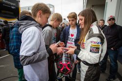 Cyndie Allemann signs autographs