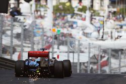 Jenson Button, McLaren MP4-28 sparks as he exits the tunnel