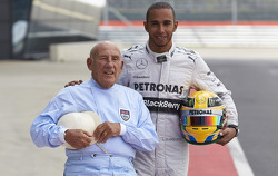 Stirling Moss and Lewis Hamilton pose for photographs