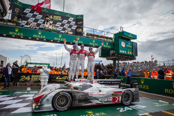 Race winners Tom Kristensen, Allan McNish and Loic Duval celebrate