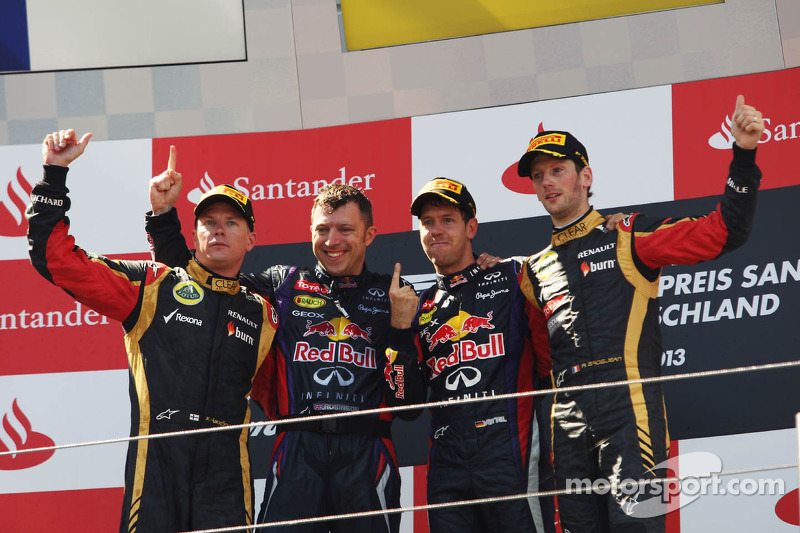 The podium, Kimi Raikkonen, Lotus F1 Team, second; Sebastian Vettel, Red Bull Racing, race winner; Romain Grosjean, Lotus F1 Team, third.