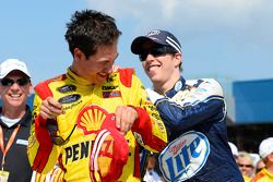 Race winner Joey Logano is congratulated by teammate Brad Keselowski