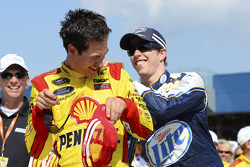 Race winner Joey Logano is congratulated by teammate Brad Keselowski