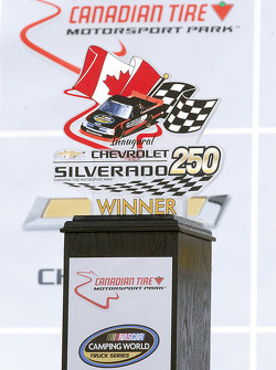 Silverado 250 trophy in victory lane