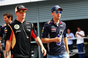 (L to R): Kimi Raikkonen, Lotus F1 Team and Sebastian Vettel, Red Bull Racing on the drivers parade