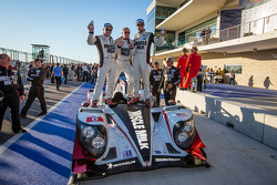 P1 and overall winners Klaus Graf and Lucas Luhr celebrate with Greg Pickett