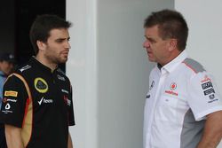 (L to R): Jerome d'Ambrosio, Lotus F1 Team Third Driver with Dr. Aki Hintsa, McLaren Team Doctor