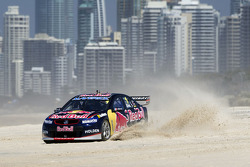 Jamie Whincup races against stunt pilot Joel Haski
