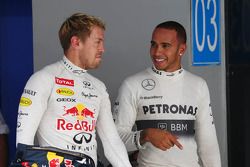 (L to R): Pole sitter Sebastian Vettel, Red Bull Racing with Lewis Hamilton, Mercedes AMG F1 in parc ferme