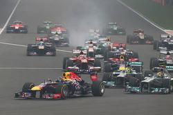 Sebastian Vettel, Red Bull Racing RB9 leads at the start of the race