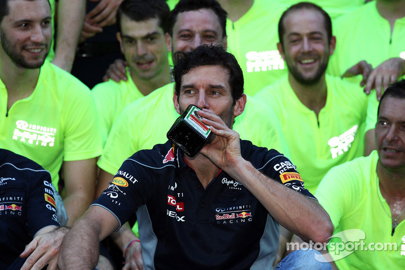 Mark Webber, Red Bull Racing with a bottle of Jagermeister at the team celebration